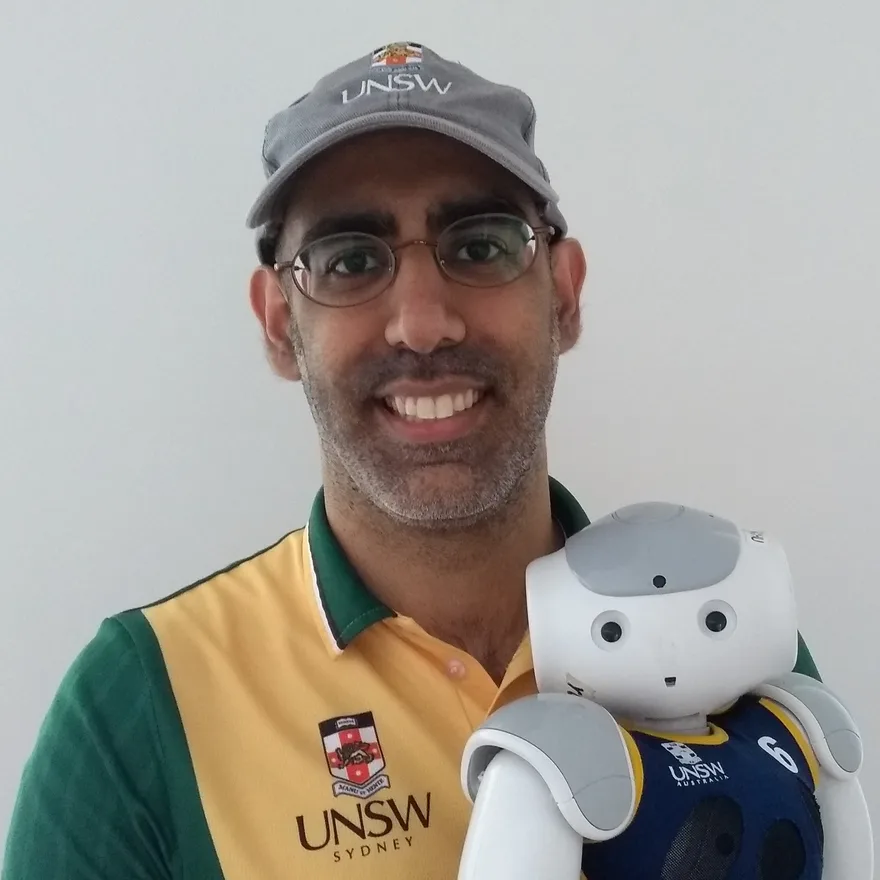 Jayen Ashar holding a NAO humanoid robot
